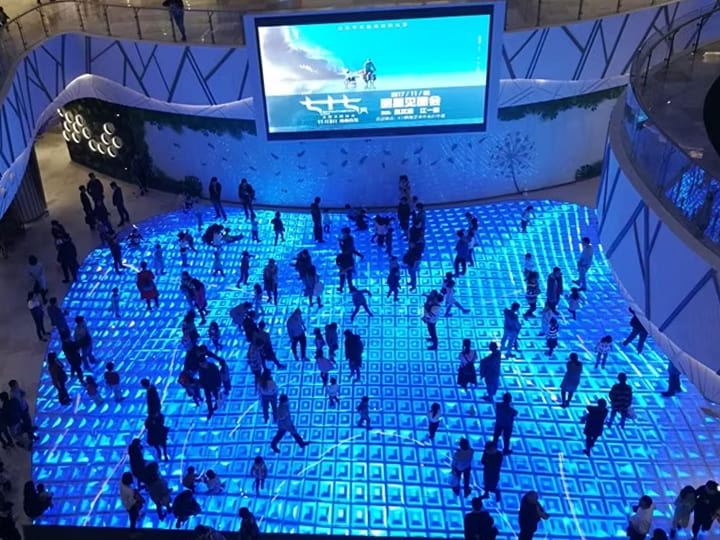 Interactive LED floor tiles attract multiple people to interact