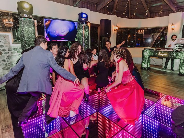 Wedding party and many people dance together