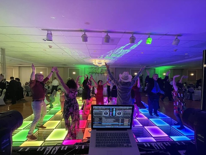 High-energy-DJ-party-with-a-large,-crowded-dance-floor.