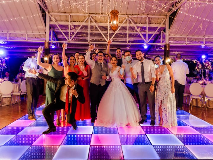 Illuminated LED dance floor transforming wedding reception
