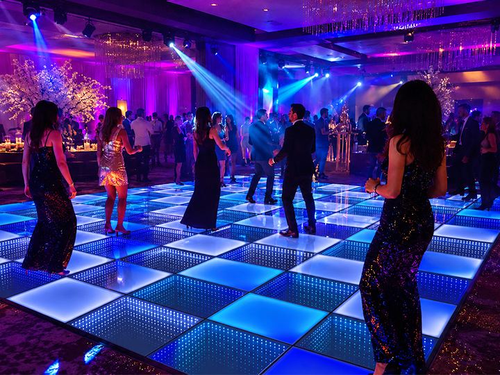 Vibrant LED dance floor party setup with colorful lights.